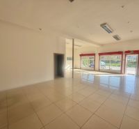 Spacious commercial spaces with large windows and tiling, ideal for business.