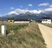 Plots - living in Mlynica with a view of the mountains and rural buildings.
