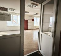 Interior of commercial premises with ceramic flooring and a sign reading 