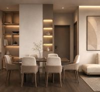 Dining area and kitchen in a holiday apartment with wood-patterned flooring.