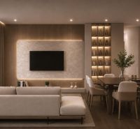 Interior of a vacation apartment with a sofa, television, and wood-patterned flooring.
