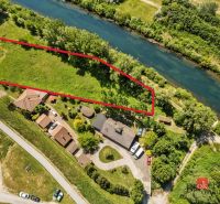 Aerial view of Recreational plots by the river in Hamuliakovo, bordered by a red line.