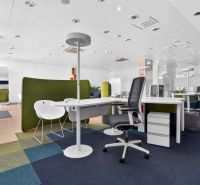 Office commercial spaces with open seating, carpet tiles, and office desks.