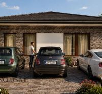 A family house with cars in the yard on residential land in Dunajský Klátov.