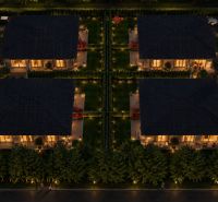 Evening view of illuminated houses with beautiful gardens in Dunajský Klátov (Plots - housing).