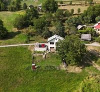 A family house in Hriňová at Pivnička 430 surrounded by greenery and meadows.