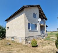 A family house on Biela Street in Kazimír with a large yard and a satellite dish.