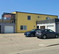 The exterior of a 3-room apartment on Okružná Street in Biely Kostol with parked cars.
