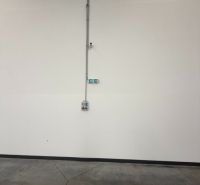 White wall with a socket in the interior of warehouses and halls.