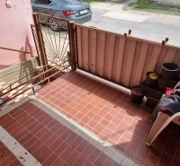 In front of the family house on Šípošova Street in Šahy, there is a terrace with paving.