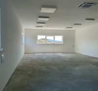Spacious empty interior in warehouses and halls with large windows.