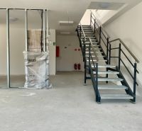 Interior with staircase in warehouses and halls with metal railing and beam.