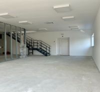 Interior of warehouses and halls with installed lighting and staircase.