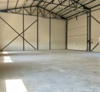 A space in the hall with an entrance gate and illuminated walls, suitable for warehouses and halls.
