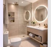 A stylish bathroom with an oval mirror and open shelves in a 4-room apartment.