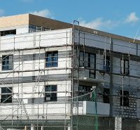 A building under construction on Tomčany Street in Martin, focusing on 3-room apartments.