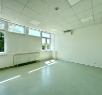 Bright commercial spaces with large windows and air conditioning.