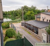 A lake and a cottage in Senec with picturesque nature and greenery around.
