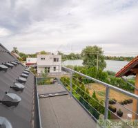 View from the Cottage in Senec of the lake and the gardens of the houses.