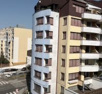 A view of Kresánkova Street in Bratislava - Karlova Ves with residential apartment buildings.