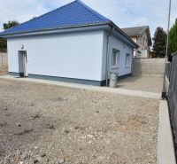 The exterior of commercial premises on Dlhoveská Street in Šaľa with a blue roof.