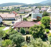 An aerial view of family houses on Severna Street in Kláštor pod Znievom surrounded by greenery.
