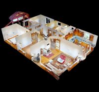 Interior of a family house with a wooden decor floor and a spacious kitchen.