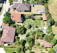 An aerial view of family houses on Severna Street in Kláštor pod Znievom surrounded by greenery.