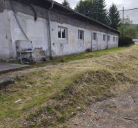 The exterior of an older building, warehouses and halls in Žiar nad Hronom, with neglected surroundings.