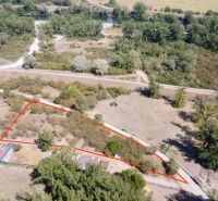 Aerial view of recreational plots in Piešťany surrounded by greenery and roads.
