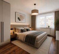 A stylish bedroom in a two-room apartment with a wooden decor floor and elegant furnishings.