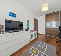 Children's room in a two-room apartment with storage space and a wooden decor floor.