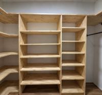 Built-in shelf with shelves and shelving system in a 2-room apartment, floor with wooden decor.