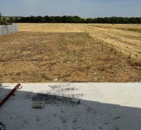 A field behind a family house in Suchá nad Parnou on Suchá nad Parnou street.