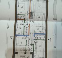 Building plan of a family house with rooms and dimensions on the drawings.