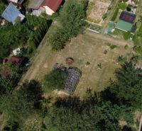 Aerial view of gardens in Detva with various greenhouses and vegetation.