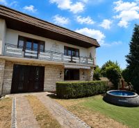 A family house in Topoľčany on Ľaliová Street with a swimming pool in the garden.