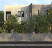 A modern building in Michalovce surrounded by greenery, suitable for a 3-room apartment.