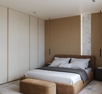 A bedroom with a wood-patterned floor in a 3-room apartment, simple design and a bed.