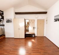 Interior with wood-patterned flooring and a wardrobe in a 3-room apartment.
