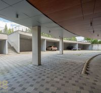A parking lot with a shelter and parked cars at the Recreation Apartment in Poprad.
