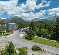 A recreational apartment in Poprad offers views of the mountains, forests, and a parking lot.