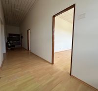 Offices with wood-patterned flooring and a kitchenette.
