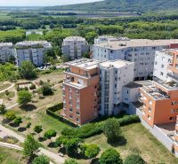 View of apartment buildings in Bratislava - Karlova Ves, Kresánkova Street, surrounded by greenery.