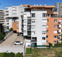 Apartment building on Kresánkova Street in Bratislava, Karlova Ves, surrounded by greenery.
