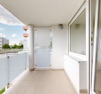 The balcony of a one-bedroom apartment with a view of the surrounding buildings on Kresánkova Street, Karlova Ves.
