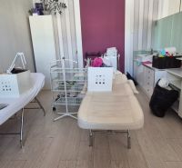 Offices with desks, a mirror, and a floor with a wood decor, white-purple walls.