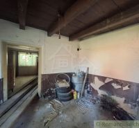 Interior of a family house with white walls and stored building materials.