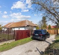 A family house on Legionárska in Mani with a yard and a black SUV by the gate.