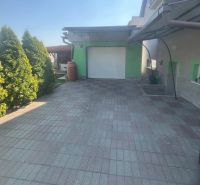 A family house on Tešmak Street in Šahy with a garage and a paved courtyard.